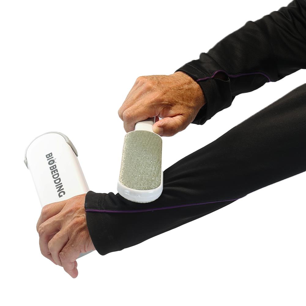 Grijze pluizenborstel met slimme reinigingssleeve