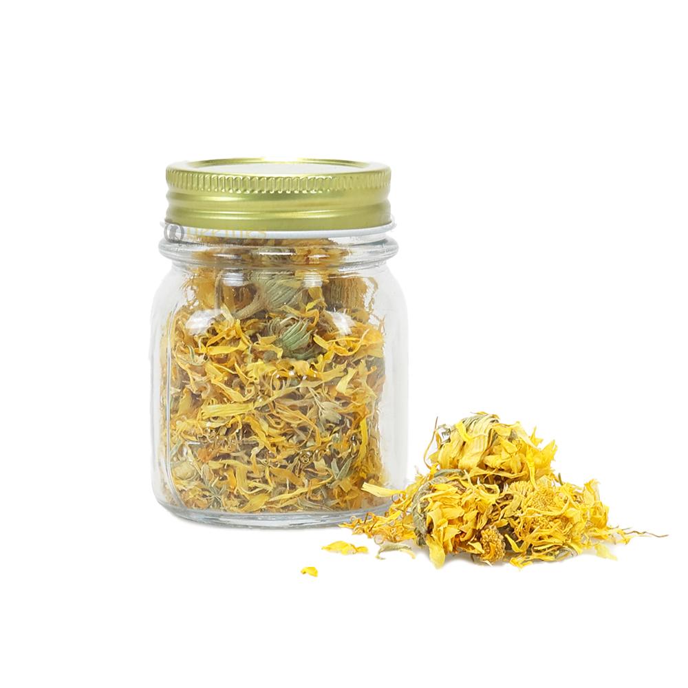 Luxe glazen potje met goudsbloemen